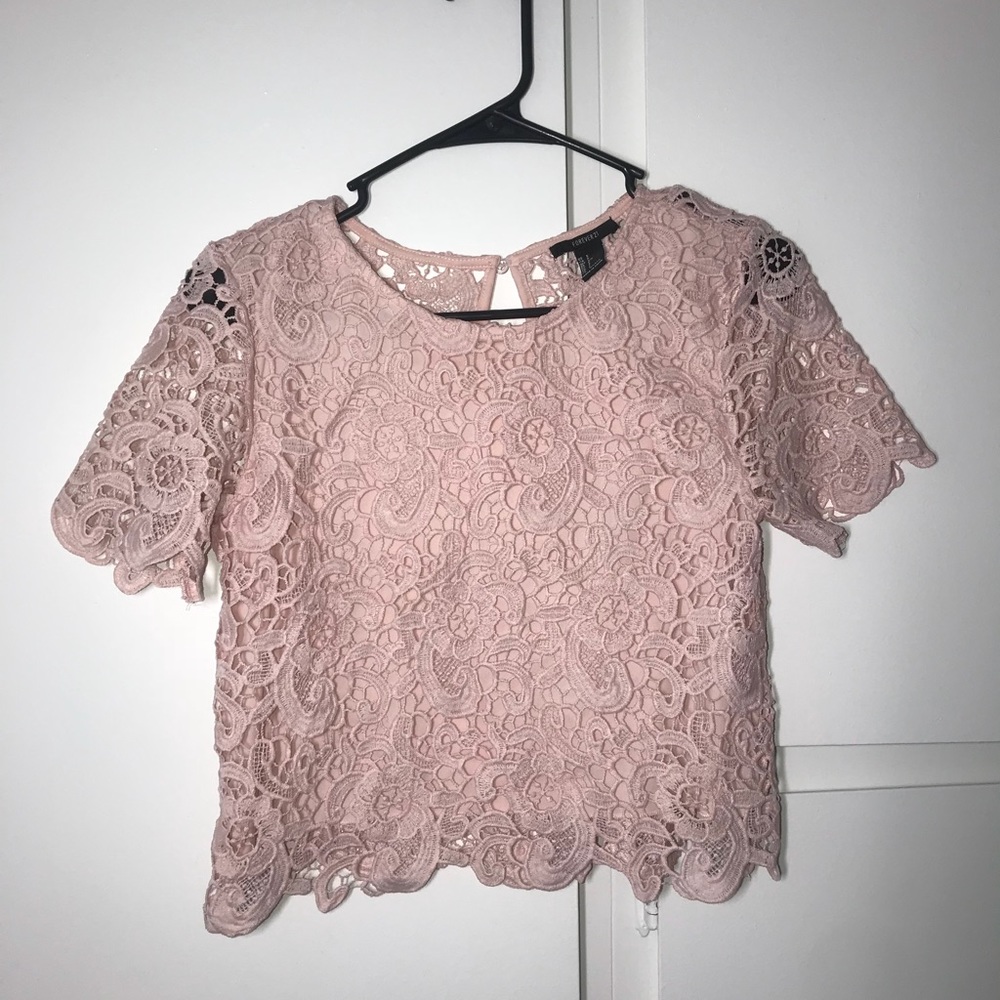 A beautiful light pink laced shirt.